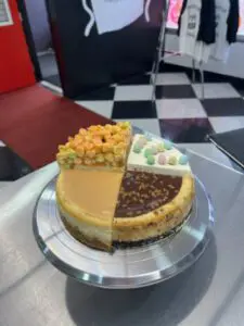 A cheesecake with different flavors on top of it.